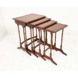 QUARTETTO TABLES, four, early 20th century Regency style mahogany on faux bamboo supports, largest