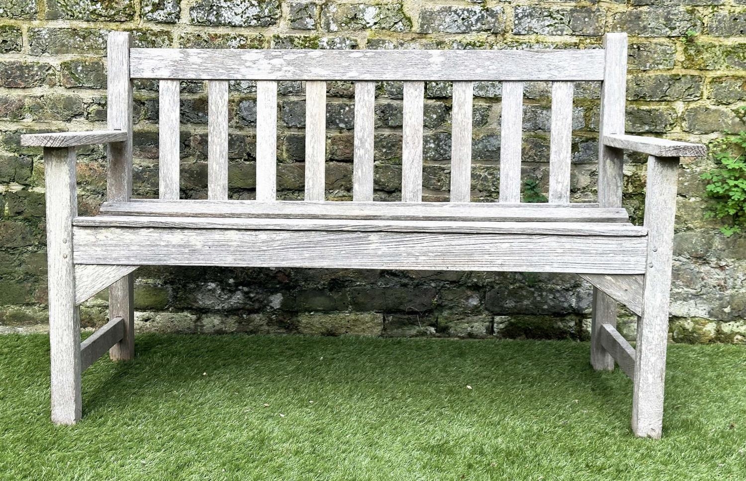 GARDEN BENCH, silvery weathered teak of slatted construction, 130cm W, by 'Lister'. - Image 8 of 8