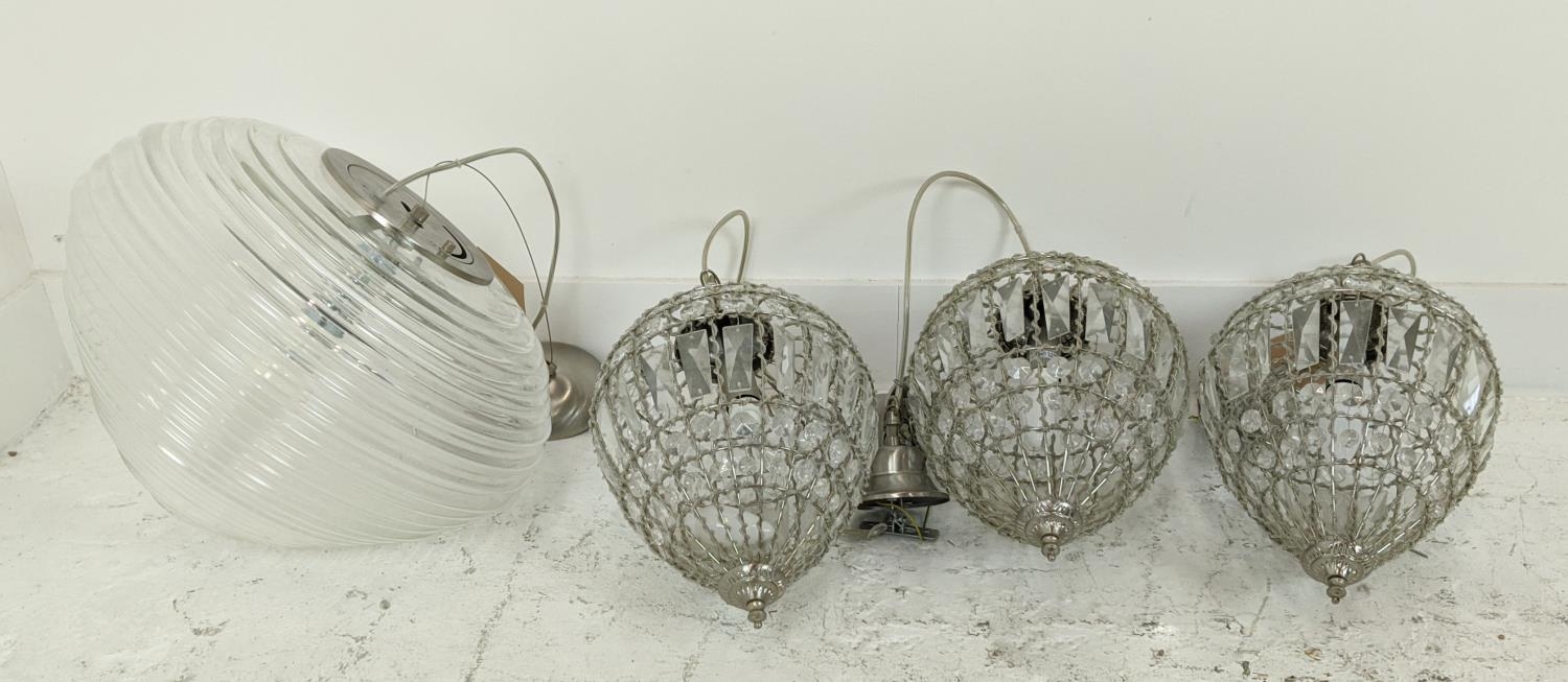 GLASS PENDANT LIGHTS, a set of three, 35cm H, and another larger ribbed glass pendant light, 35cm