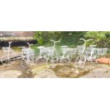 BICYCLE PLANTERS, a set of four, white painted metal, 63cm H x 88cm x 44cm. (4)