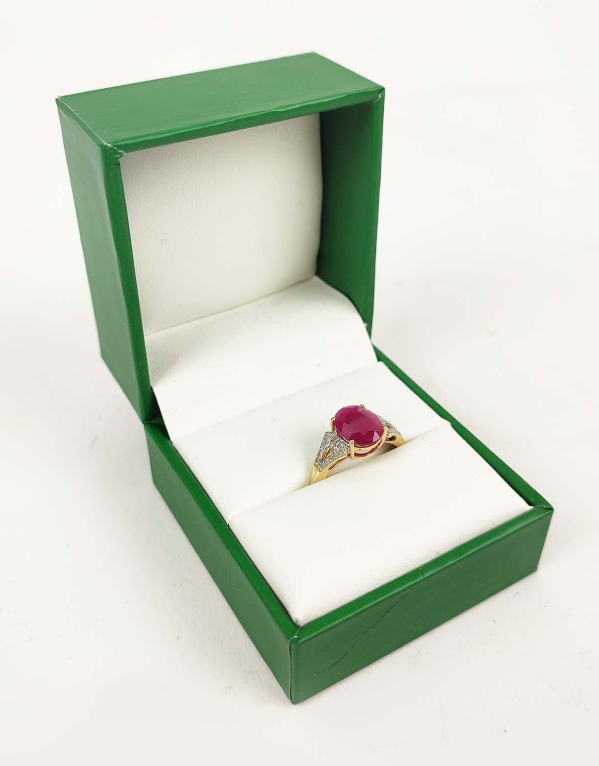 A 9CT GOLD RUBY AND DIAMOND RING, the mixed cut ruby stone claw set, diamond shoulders, ring size Q, - Image 2 of 4