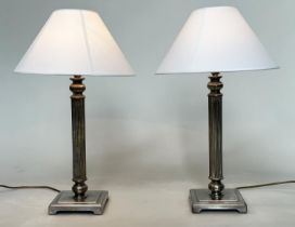 TABLE LAMPS, a pair, silvered metal each with reeded column, and square bases (with shades), 66cm H.