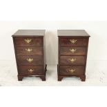 BEDSIDE CHESTS, a pair, late 19th/early 20th century mahogany, labelled S & H Jewel of four drawers,