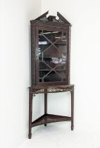 GLAZED CORNER CABINET ON STAND, Edwardian mahogany in Chippendale style with door and carved