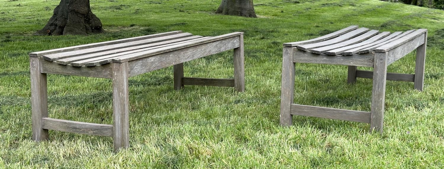 GARDEN BENCHES, a pair, well weathered teak and slatted, 140cm W x 50cm D x 44cm H. (2) - Image 2 of 6