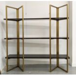 BOOKCASE, two gilt metal supports holding three veneered shelves, 200cm x 50cm x 208.5cm approx.