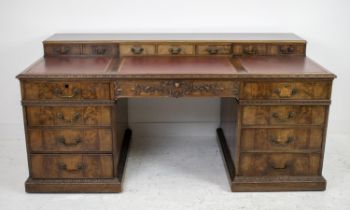 PEDESTAL DESK, Georgian revival mahogany, circa 1900, with superstructure of seven drawers above red