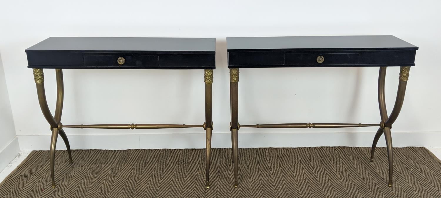 CONSOLE TABLES, a pair, gilt metal X frame supports, each with one drawer, 101cm x 32.5cm x 86.