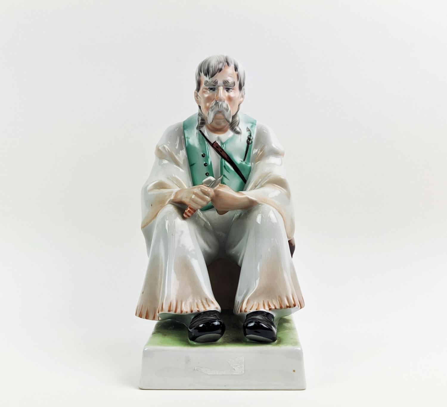 A ZSOLNAY FIGURE OF A MAN WITH A KNIFE, seated, made in Hungary, hand painted, 33cm high - Image 9 of 9