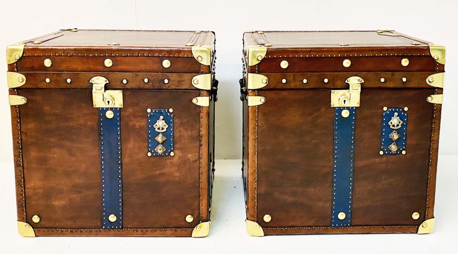 STEAMER TRUNKS, a pair, leathered and gilt metal bound with faux military decoration, 51cm H x