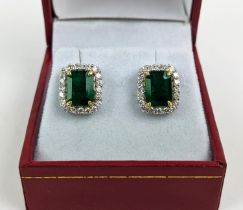 A PAIR OF 18CT WHITE GOLD EMERALD AND DIAMOND STUD EARRINGS, step cut emeralds of approximately 3.23