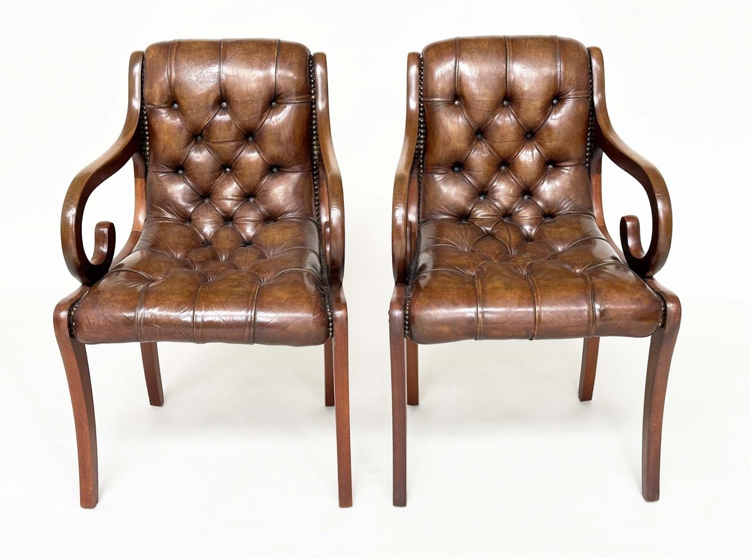 LIBRARY ARMCHAIRS, a pair, Georgian style buttoned soft natural antique brown leather upholstered
