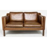 SOFA, two seater grained soft natural tan brown leather with teak supports, 143cm W.