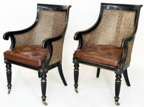 LIBRARY BERGERES, a pair Regency design lacquered, gilded and cane panelled each with button