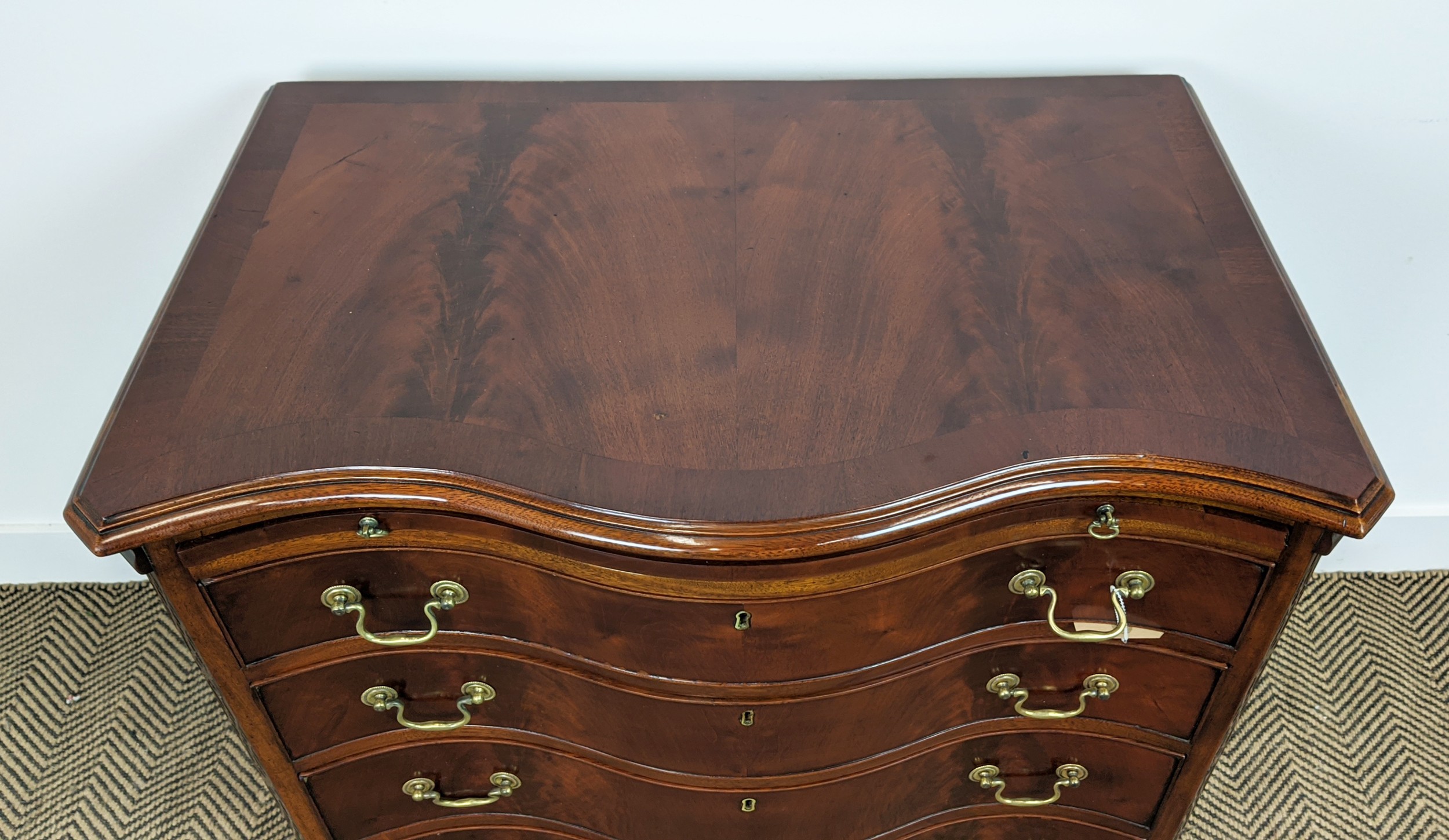 SERPENTINE CHEST, George III style mahogany with brushing slide above four drawers, 78cm H x 81cm - Image 2 of 10