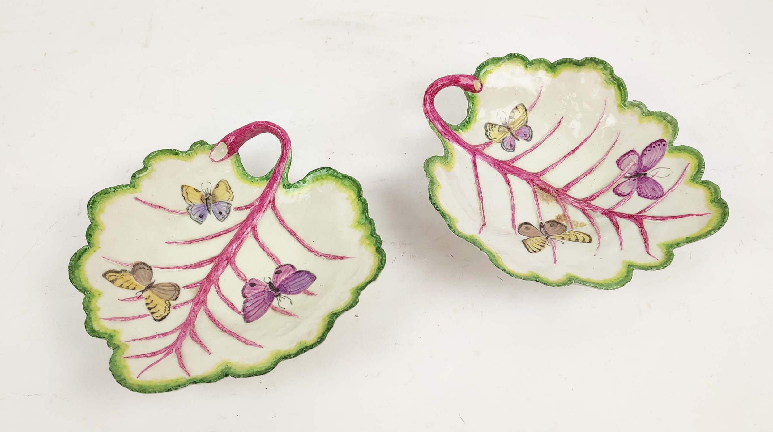 LADY ANNE GORDON (1924-2007) CERAMIC LEAF PLATES, a pair, with butterfly decoration, monogrammed