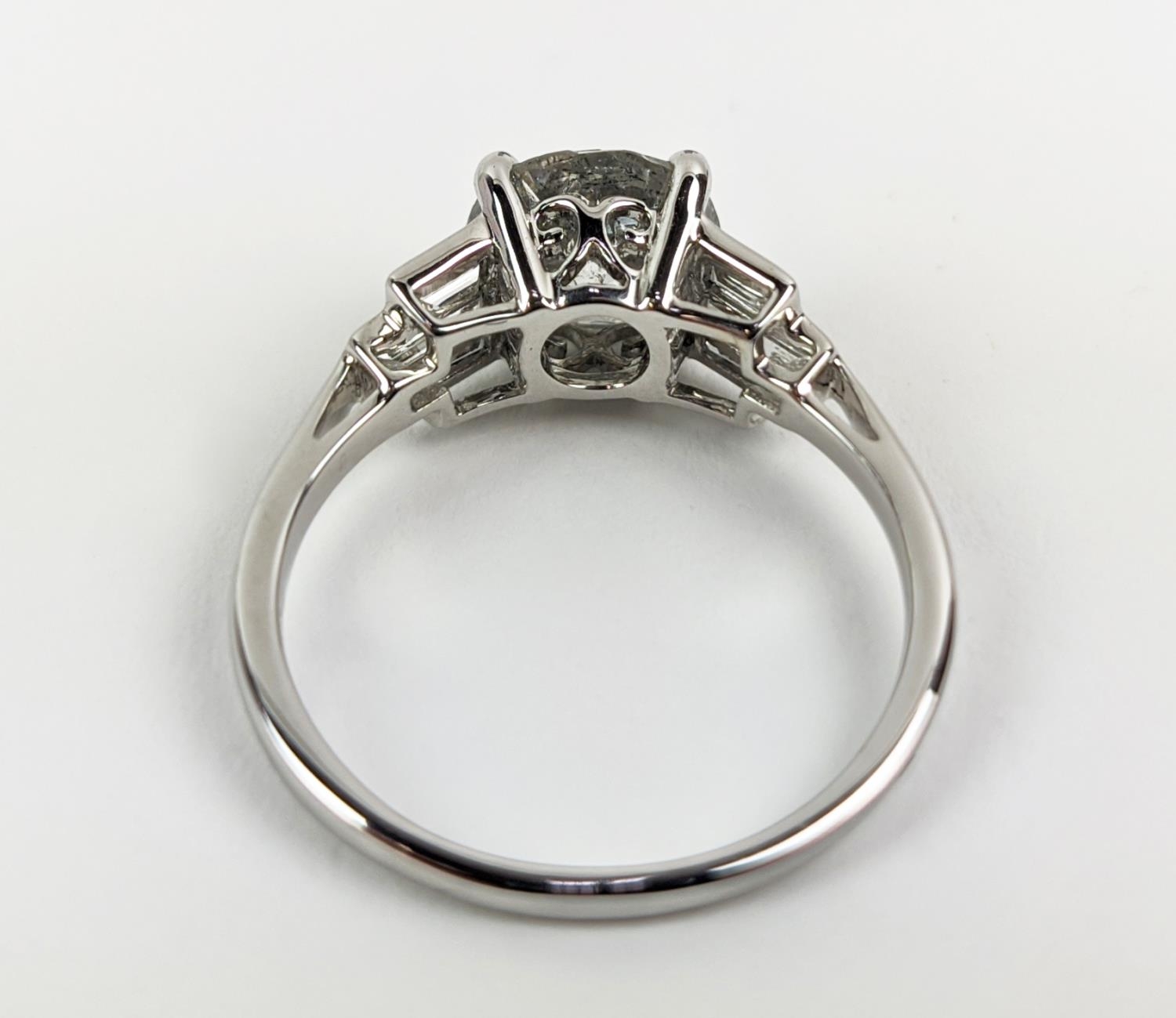AN 18CT WHITE GOLD DIAMOND SOLITAIRE RING, with baguette cut diamonds to shoulders, the central - Image 6 of 9