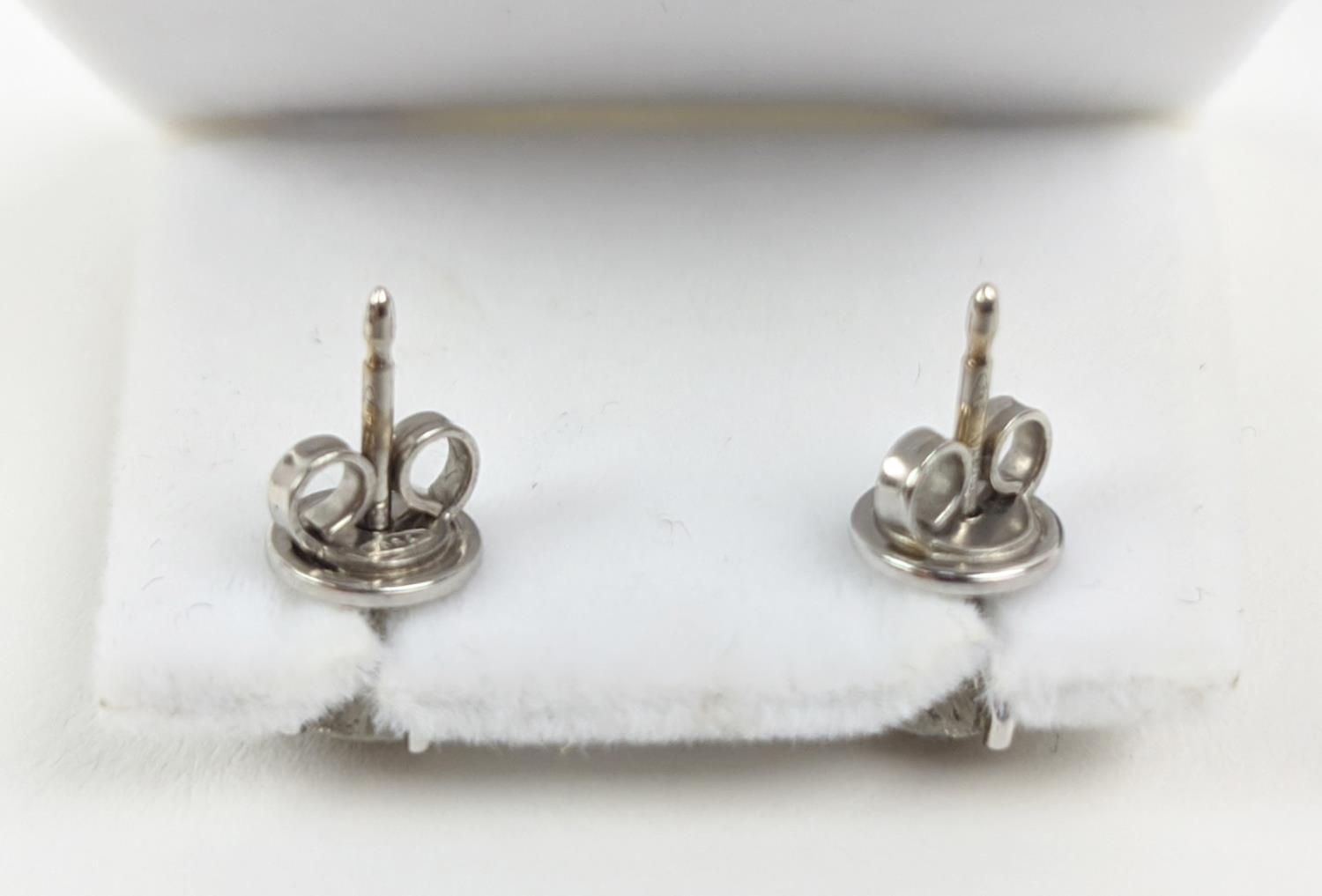 A PAIR OF 18CT WHITE GOLD DIAMOND SOLITAIRE STUD EARRINGS, each with a claw set round brilliant - Image 5 of 6