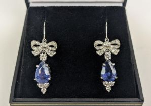 A PAIR OF 18CT WHITE GOLD SAPPHIRE AND DIAMOND PENDANT EARRINGS, central pear shaped faceted