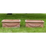 GARDEN PLANTERS, a pair, weathered Tuscan terracotta of trough form with garland swag decoration,