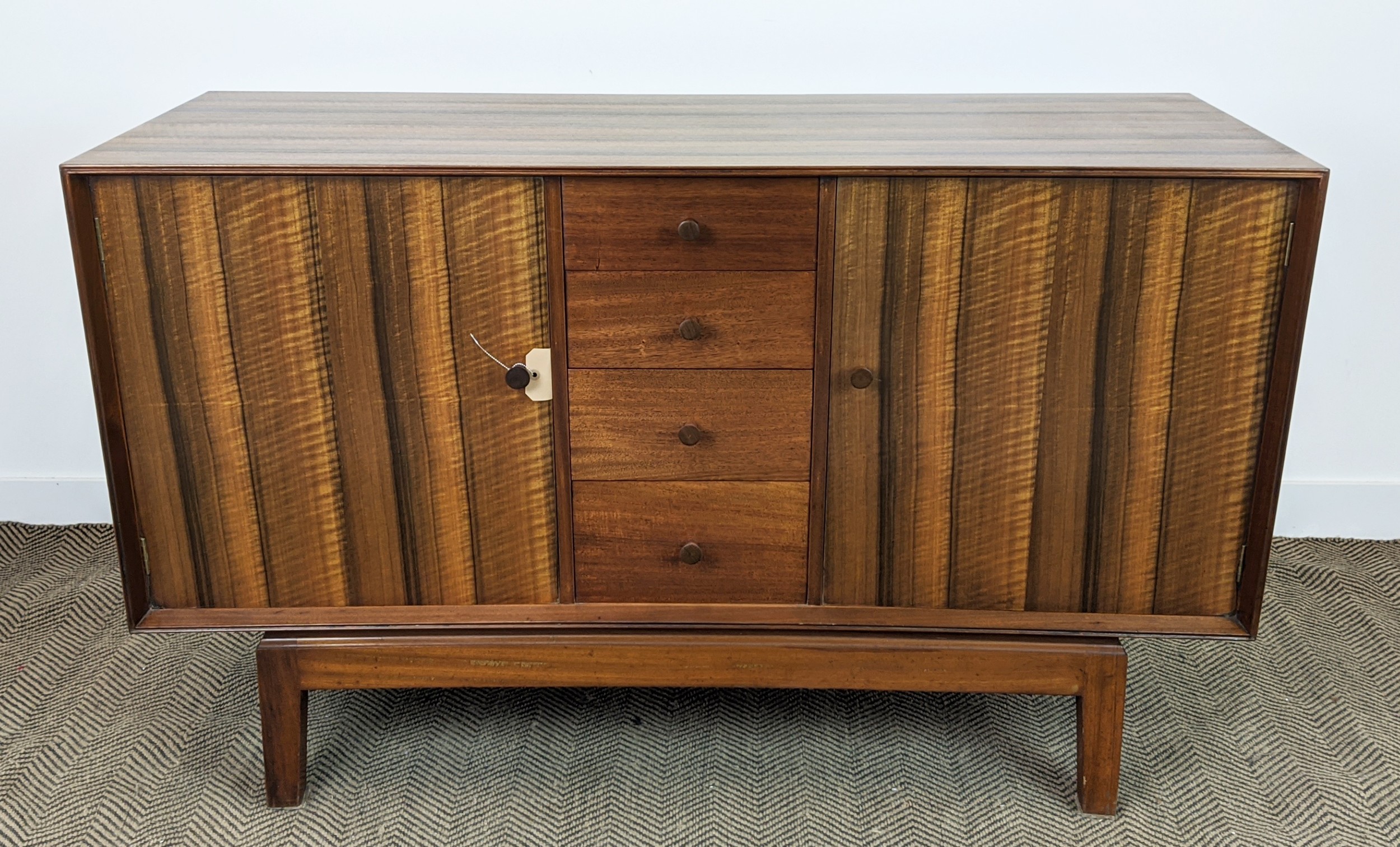 HEAL'S SIDEBOARD, mid 20th century walnut with four drawers flanked by two doors, 90cm H x 145cm x