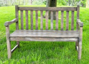 GARDEN BENCH, well weathered teak of slatted and pegged construction with shaped arms, 120cm W.