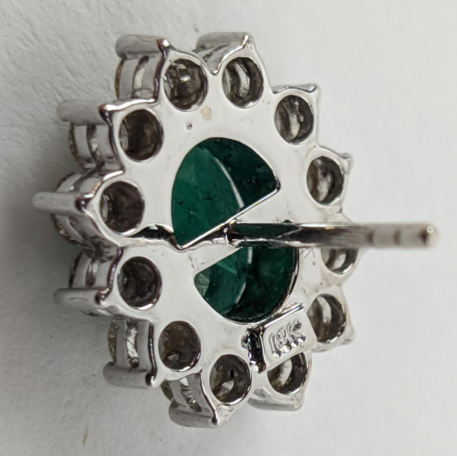 A PAIR OF 18CT WHITE GOLD EMERALD AND DIAMOND CLUSTER STUD EARRINGS, the oval mixed cut emerald - Image 7 of 8