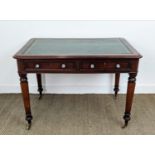 WRITING TABLE, Victorian mahogany with green leather above two drawers on brass castors, 75cm H x