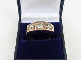 A GENTS DIAMOND GYPSY RING, set with three brilliant cut diamonds of approximately 0.80 carats each,