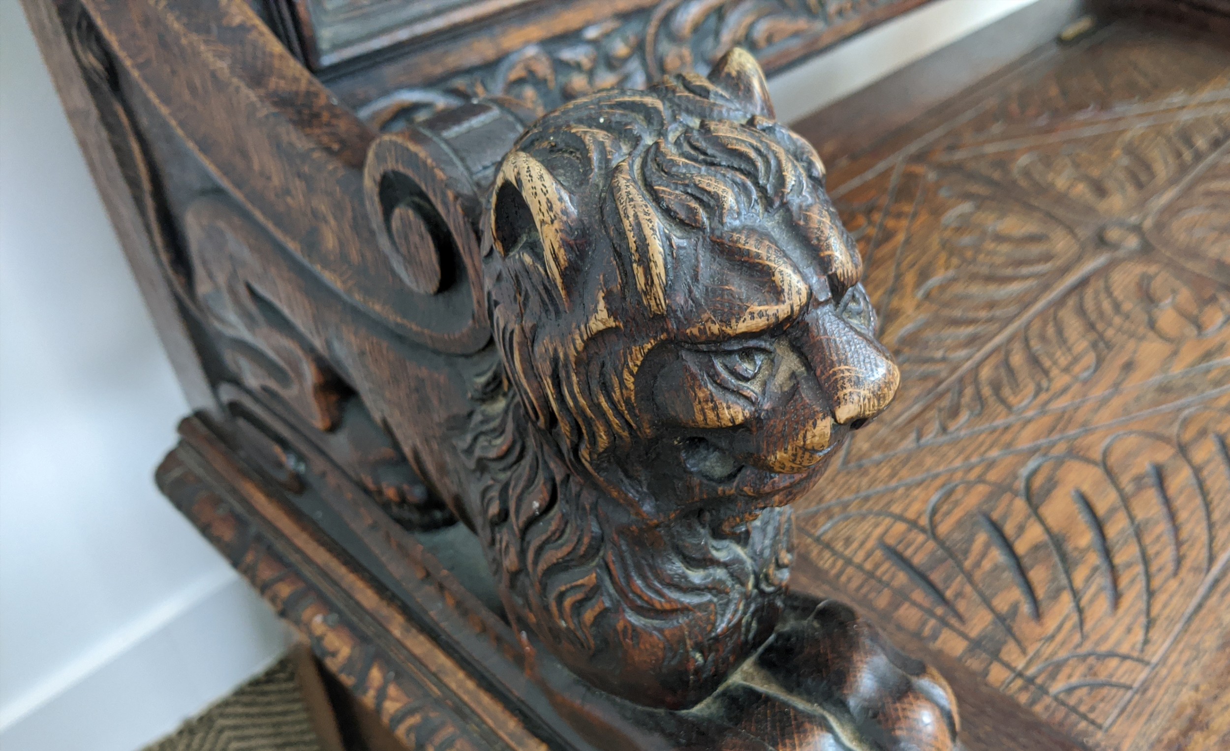 SETTLE, early 20th century Jacobean style oak with lion carved arms and hinged seat, 122cm H x - Image 11 of 12