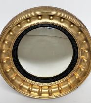 CONVEX WALL MIRROR, Regency giltwood with convex mirror plate and ball encrusted moulded frame, 56cm