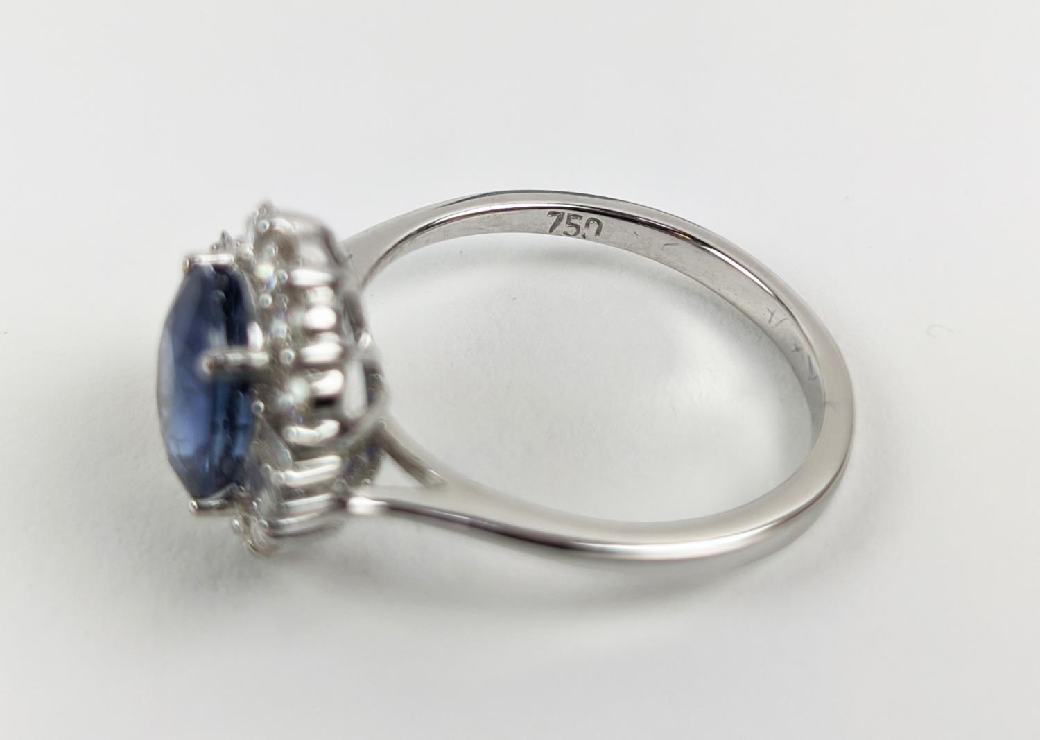 AN 18CT WHITE GOLD SAPPHIRE AND DIAMOND HALO RING, the central oval mixed cut sapphire of - Image 8 of 9