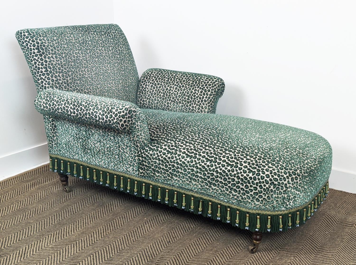 GEORGE SMITH BUTTERFLY CHAISE, leopard print cut velvet upholstery with bullion fringe, raised on