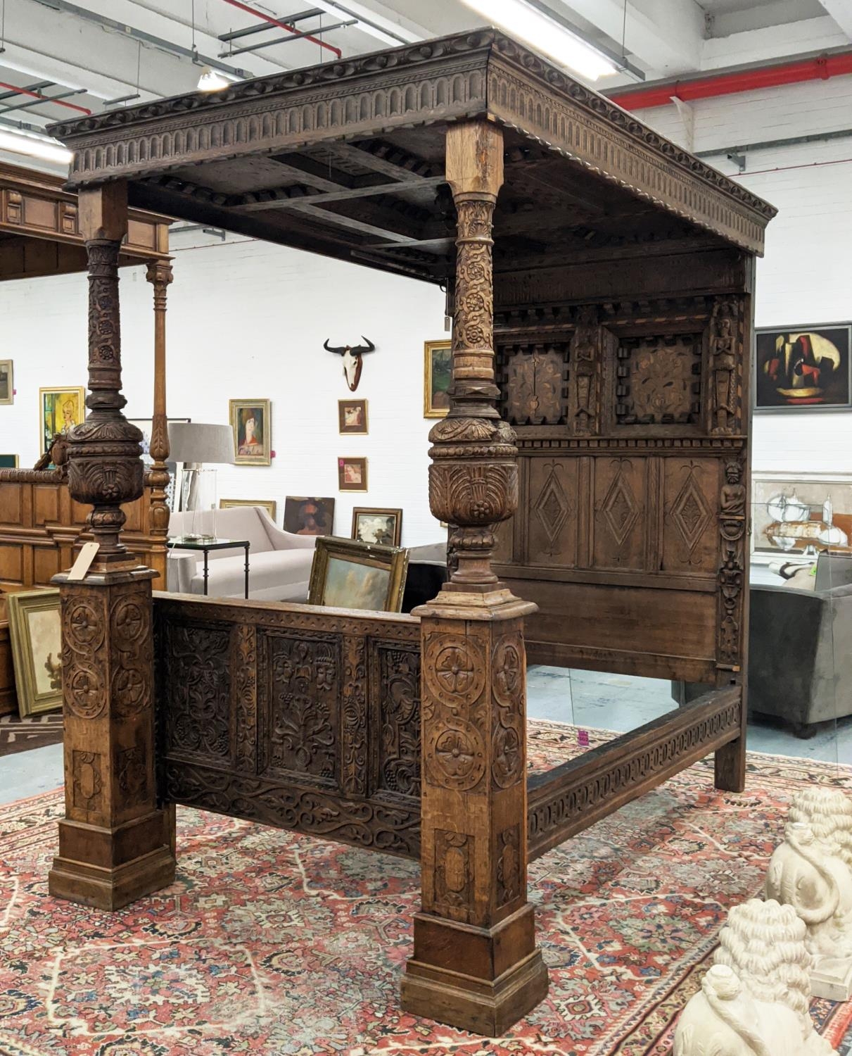 TESTER BED, 17th century oak, holly and fruitwood inlaid, carved panelled rectangular canopy above a