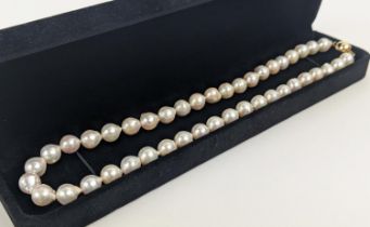 CULTURED PEARL SINGLE STRAND NECKLACE, each pearl of round irregular form, 8mm diam approx, 14ct