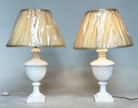 TABLE LAMPS, a pair, Italian alabaster of spiral urn form with stepped square bases and shades, 66cm