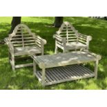 LUTYENS STYLE GARDEN ARMCHAIRS, a pair, well weathered teak, 103cm H x 90cm W, together with a