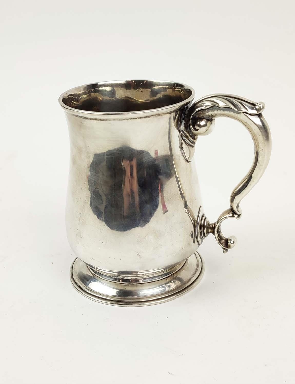 SILVER MUG, George III, London 1765, makers Mark WJ, acanthus cast handle, footed base, 12cm high,