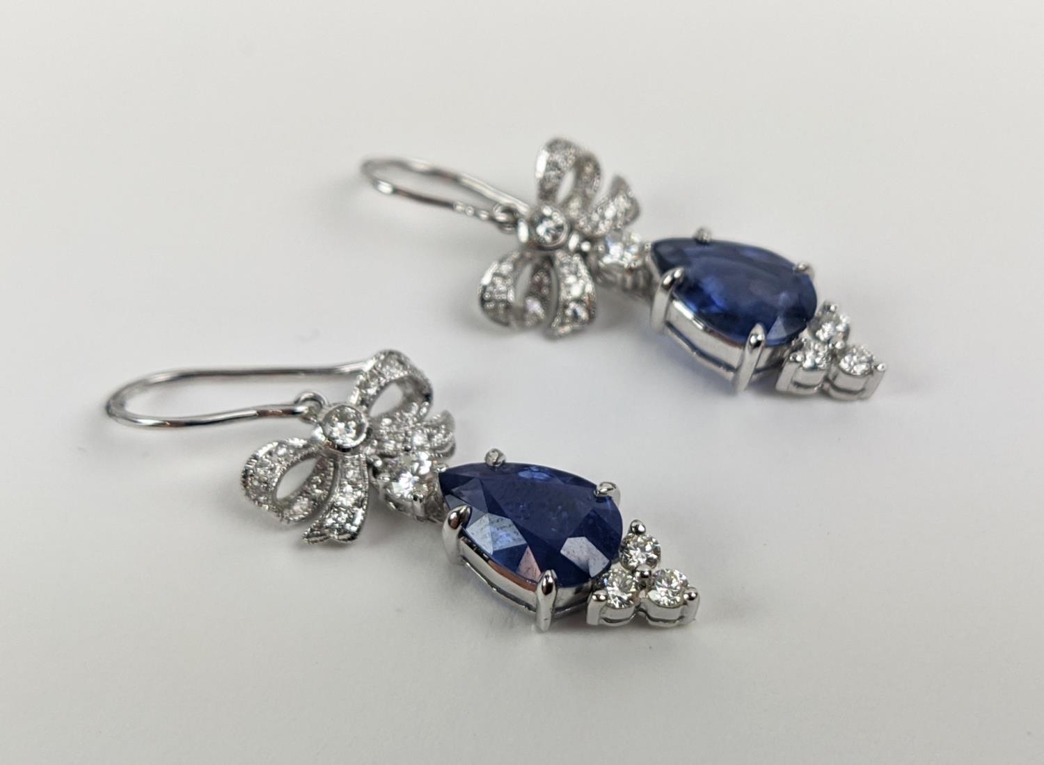 A PAIR OF 18CT WHITE GOLD SAPPHIRE AND DIAMOND PENDANT EARRINGS, central pear shaped faceted - Image 6 of 7