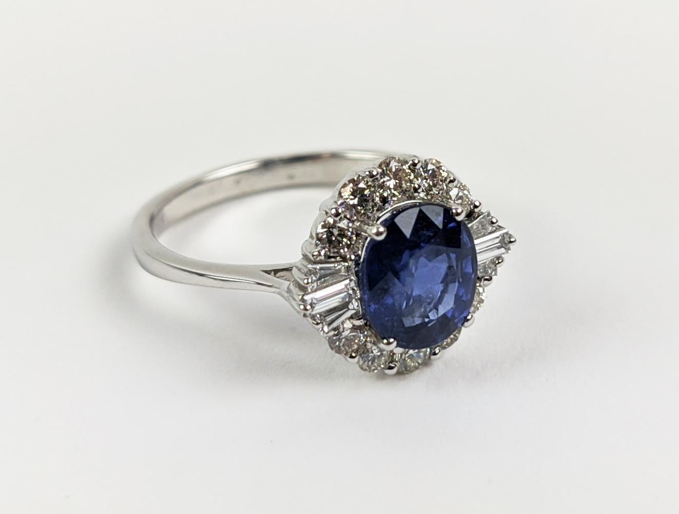 AN 18CT WHITE GOLD SAPPHIRE AND DIAMOND HALO RING, the central oval mixed cut sapphire of - Image 6 of 9