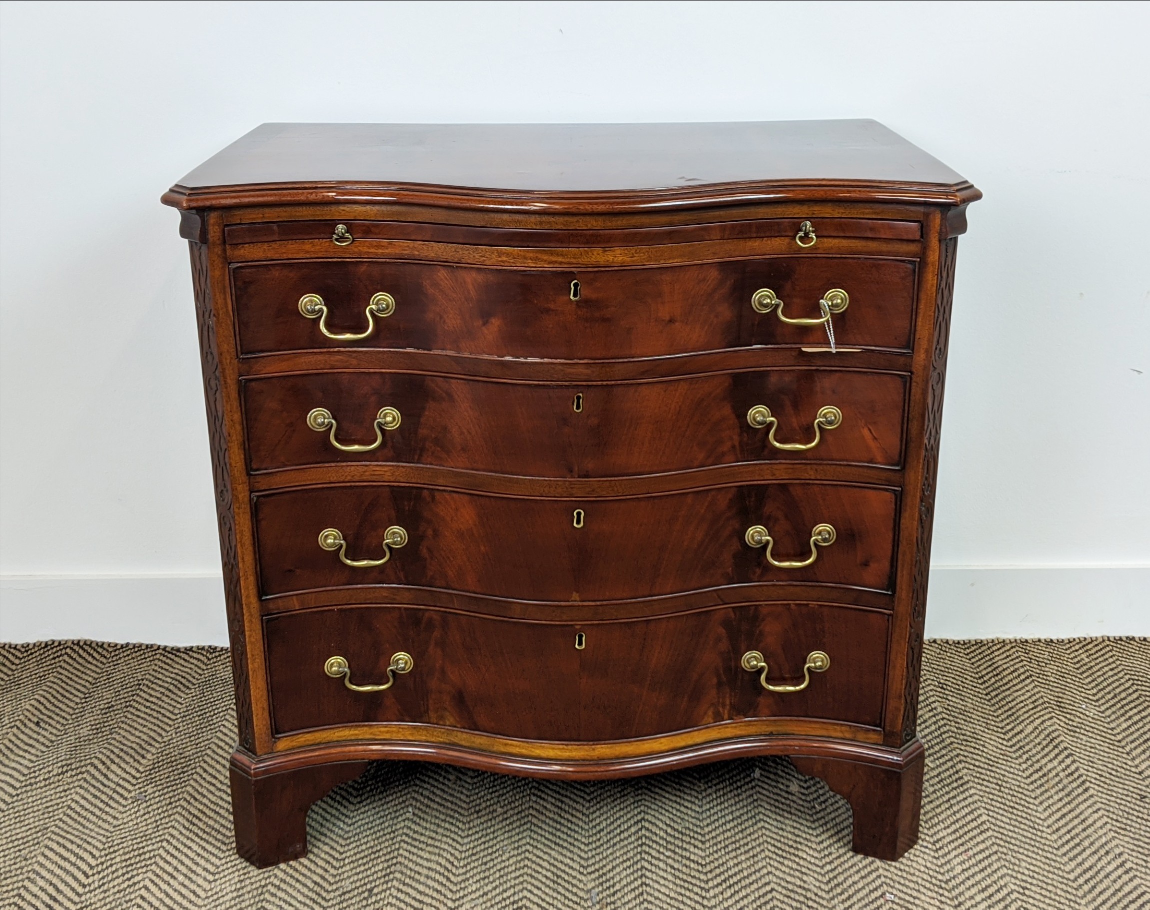 SERPENTINE CHEST, George III style mahogany with brushing slide above four drawers, 78cm H x 81cm - Image 10 of 10