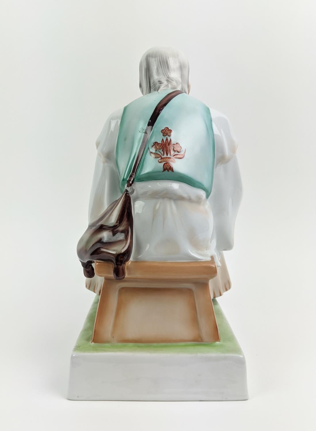 A ZSOLNAY FIGURE OF A MAN WITH A KNIFE, seated, made in Hungary, hand painted, 33cm high - Image 5 of 9