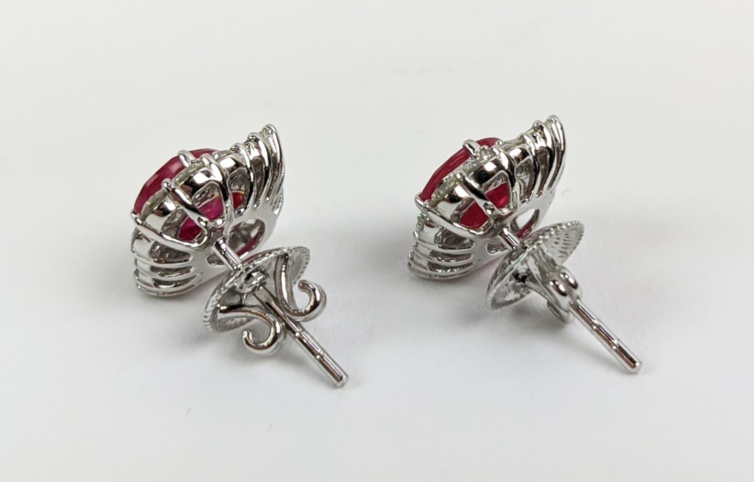 A PAIR OF 18CT WHITE GOLD RUBY AND DIAMOND STUD EARRINGS, the central mixed cut stones of - Image 6 of 7