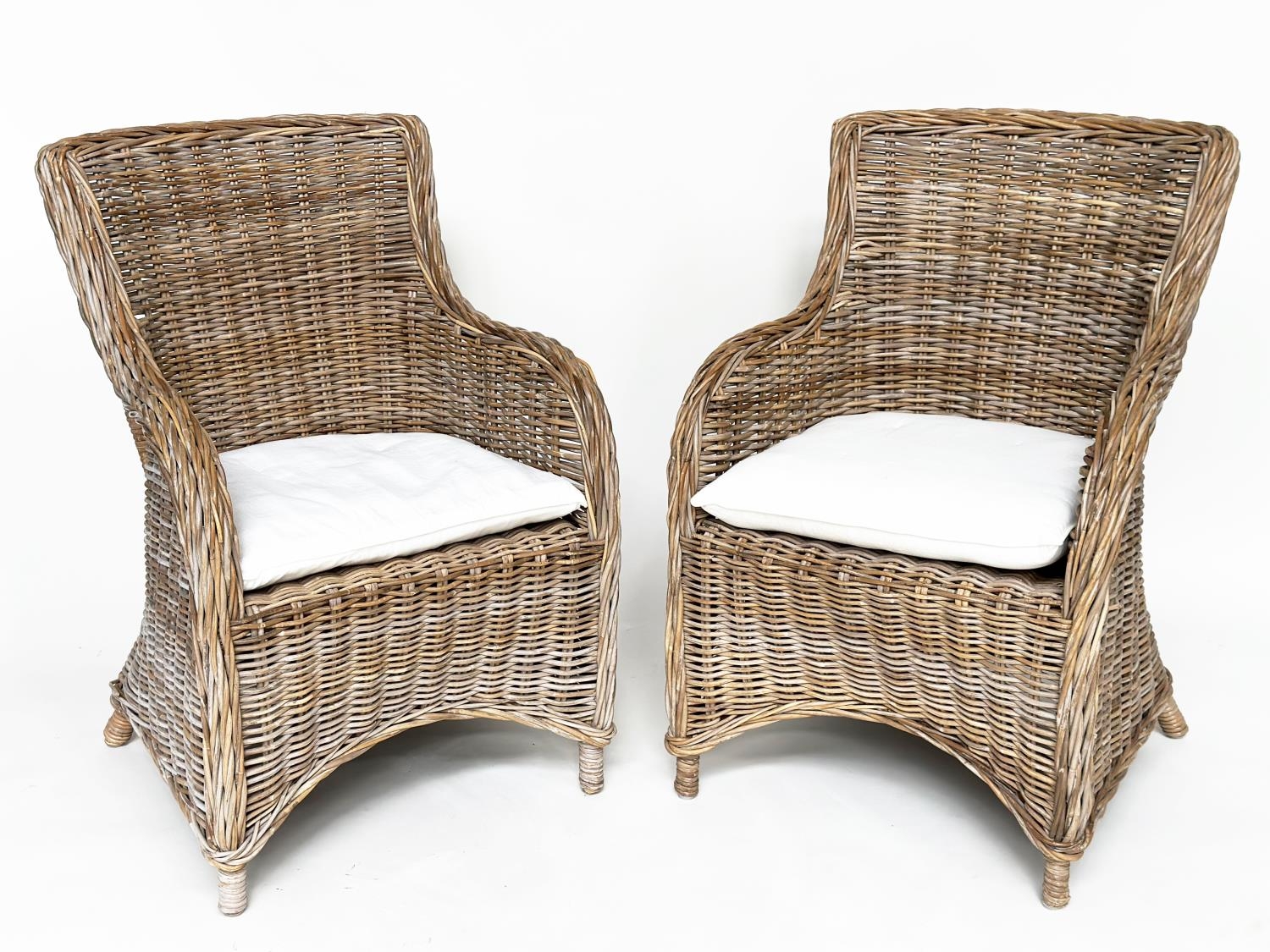 ORANGERY ARMCHAIRS, a pair, rattan framed and cane bound with cushions. (2)