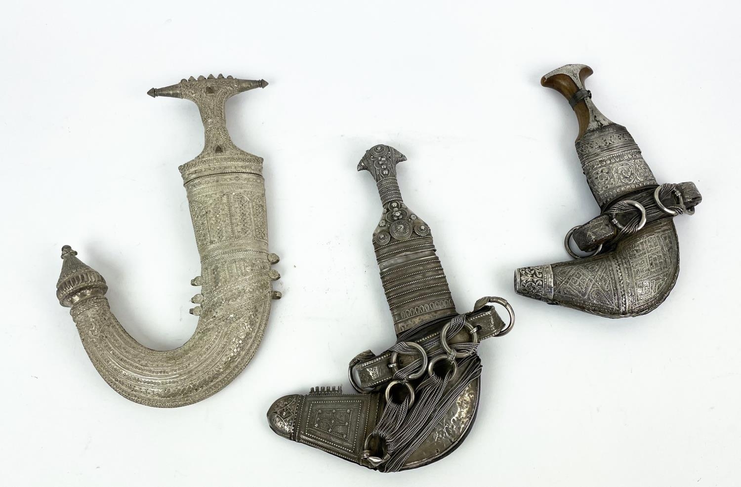 OMANI KHANJAR DAGGERS, two 19th century silver thread and a Syrian Jambiya, Jambiya 35cm H. (3)