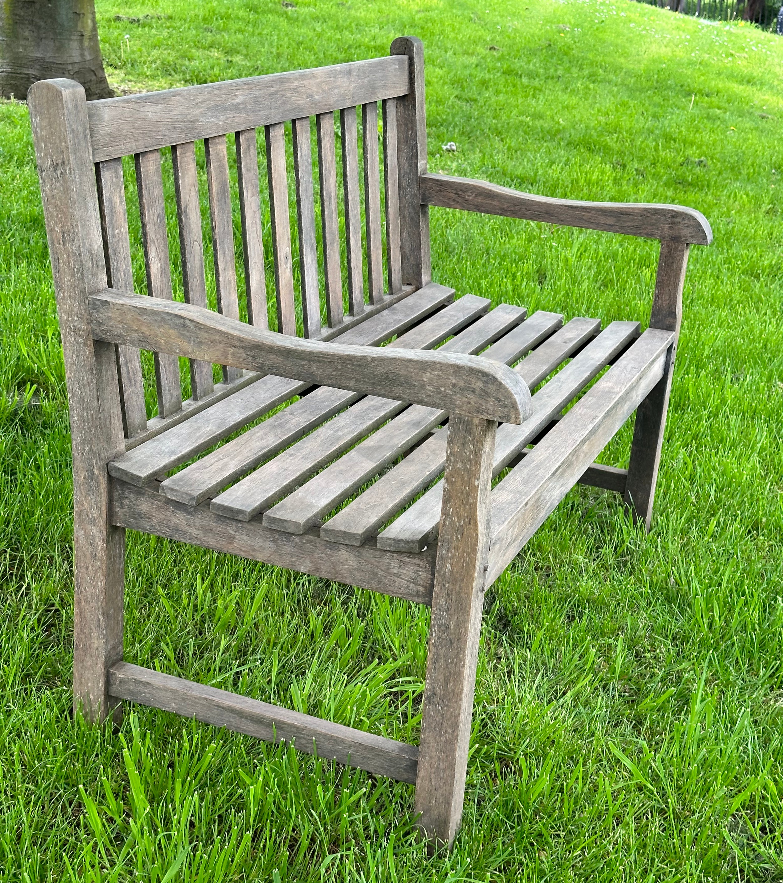 GARDEN BENCH, well weathered teak of slatted and pegged construction with shaped arms, 120cm W. - Image 5 of 6
