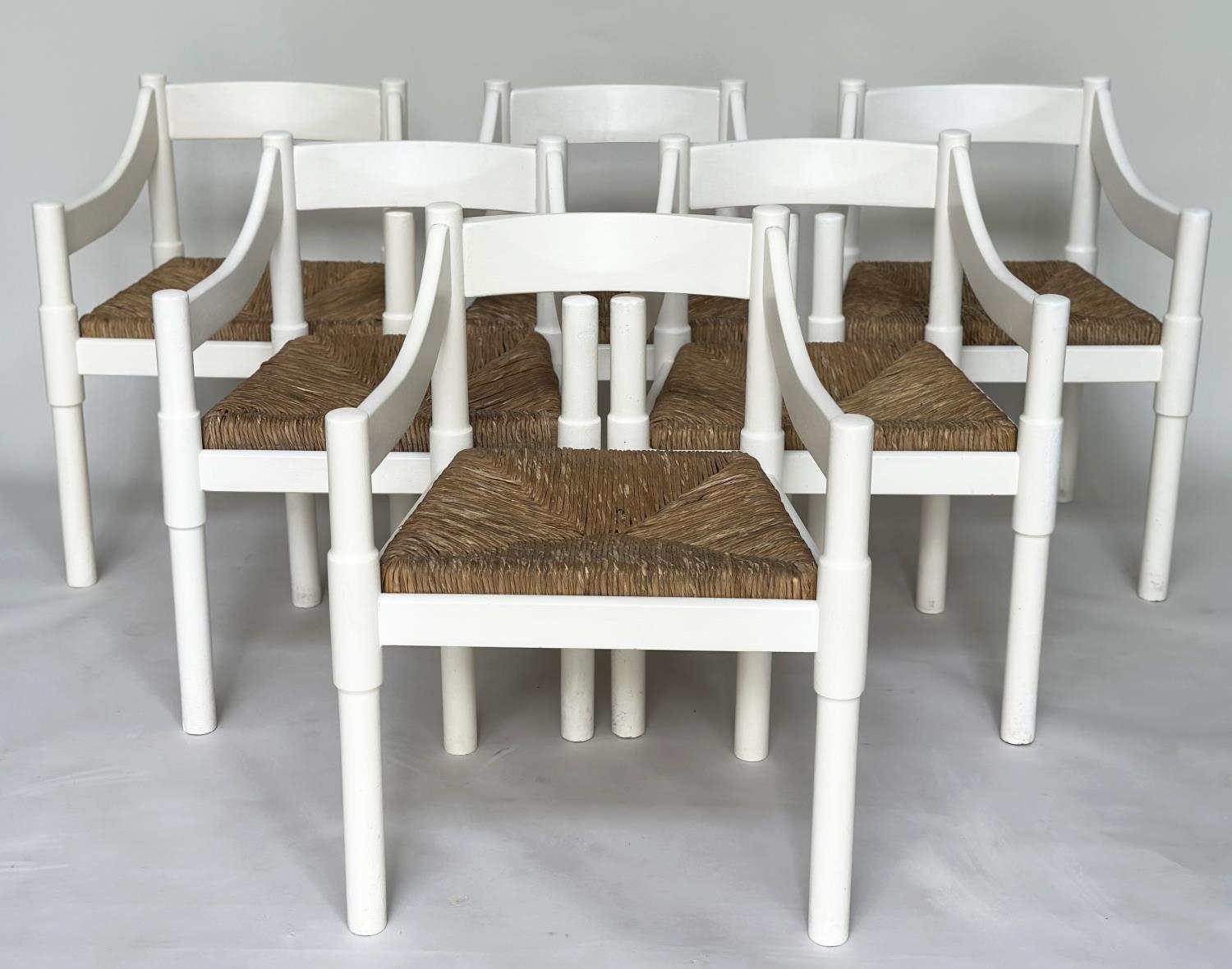 ATTRIBUTED TO VICO MAGISTRETTI CARIMATE CHAIRS, a set of six, white with rush seats. (6)