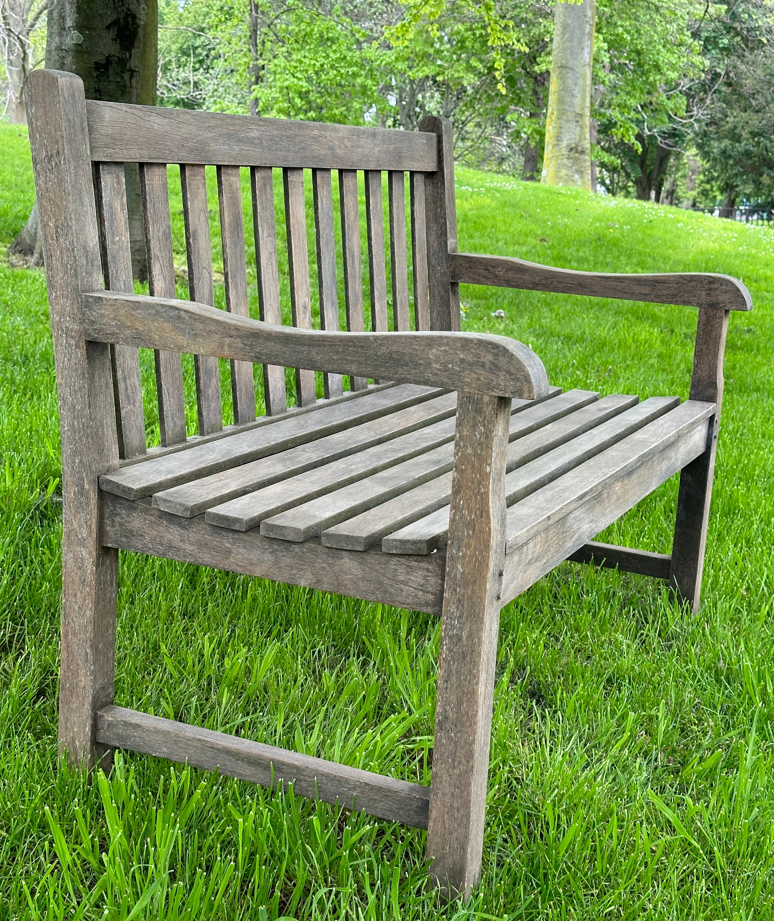 GARDEN BENCH, well weathered teak of slatted and pegged construction with shaped arms, 120cm W. - Image 6 of 6