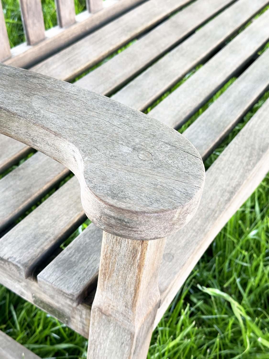 GARDEN BENCH BY 'BRIDGMAN AND CO', well weathered teak slatted with shaped yoke and shaped flat - Image 14 of 18