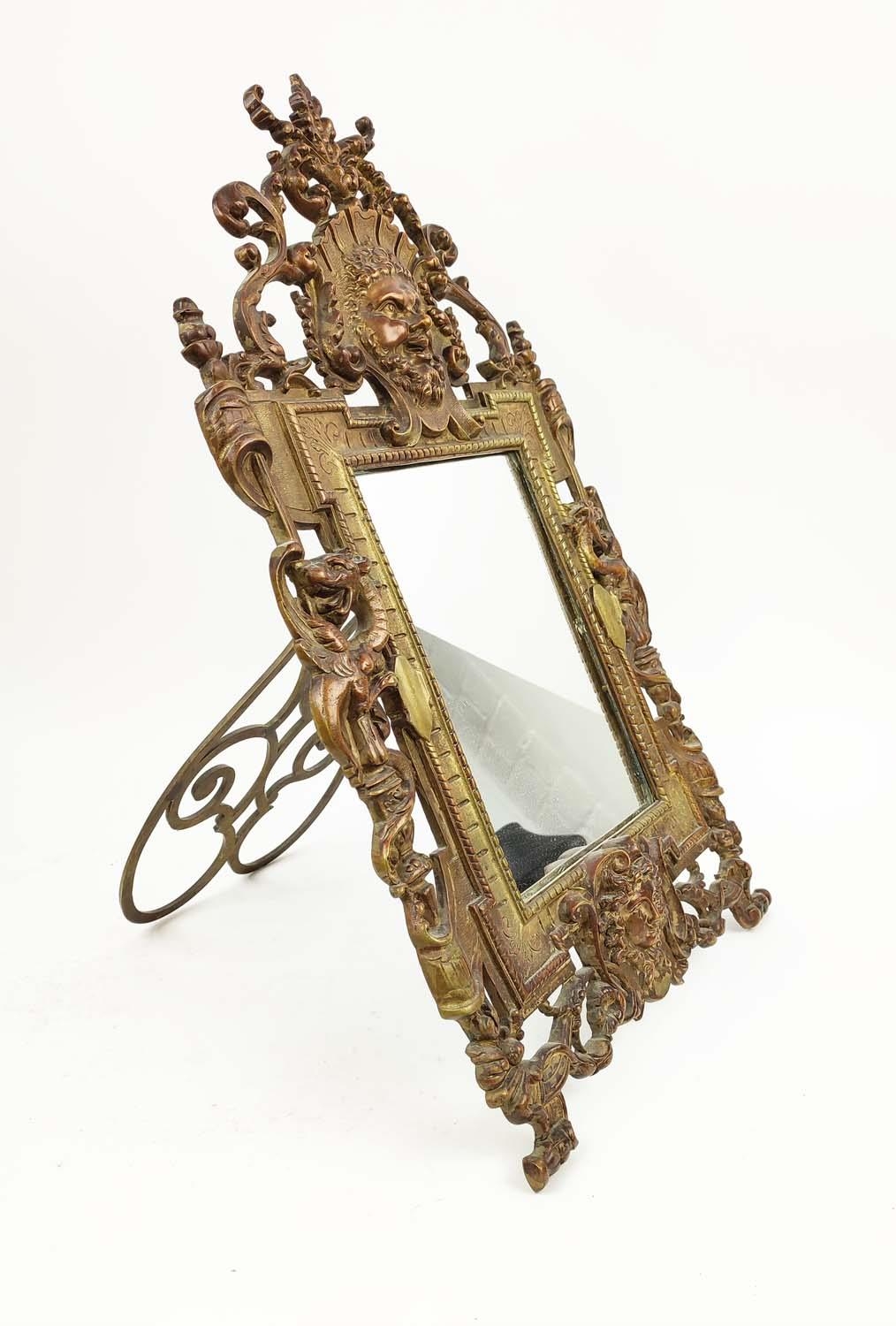 A LATE 19TH CENTURY FRENCH EASEL MIRROR, circa 1870, Renaissance revival bronze with cast embossed